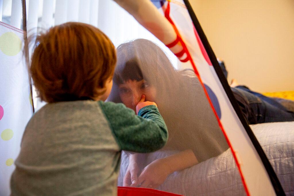 Sylvia and Bodhi Johnston play in a ball pit in Bodhi's room. March 26, 2022.
