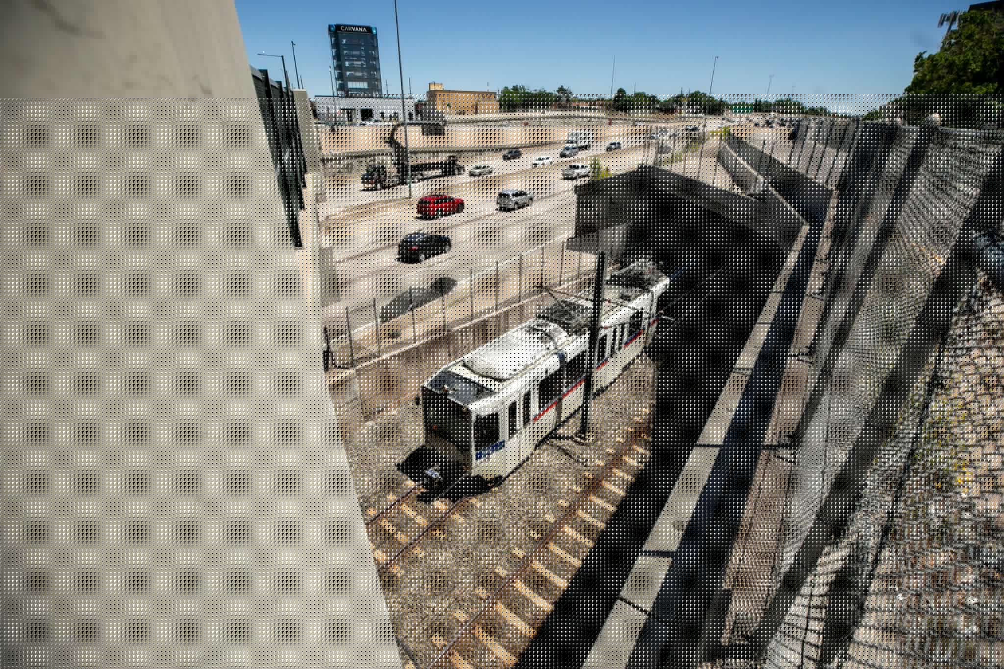 An RTD train passes under Evans Avenue in Denver. June 6, 2024.